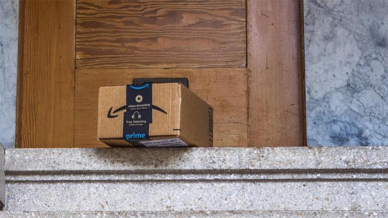Amazon package left on a porch, vulnerable to porch pirates